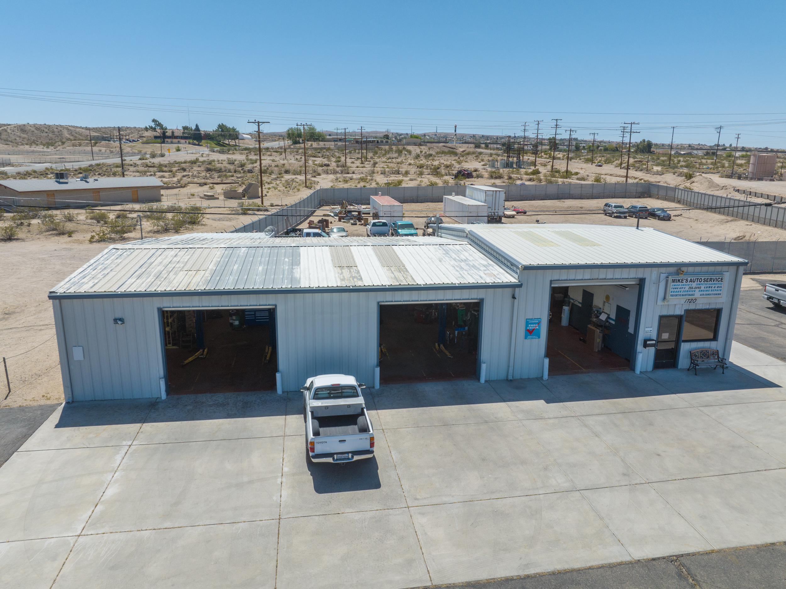 Exterior aerial view of five bay auto repair facility on West Main Street in Barstow California